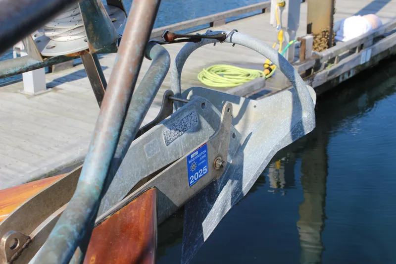 Slide: The Image of Bow of Custom Gartside Jespersen 40 yacht, 2012, with anchor and dock in background. - 14