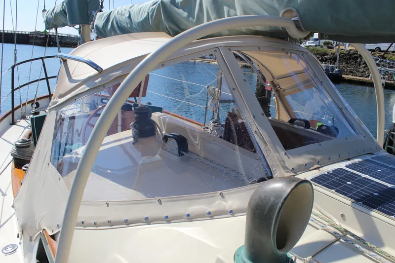 Slide: The Image of Sailboat cockpit with protective canopy, featuring winches and solar panel, Custom Gartside Jespersen 40, 2012. - 18