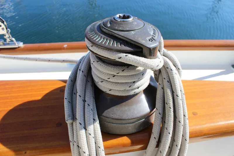 Slide: The Image of Sailboat winch with rope on Custom Gartside Jespersen 40, 2012 model, by the water. - 30