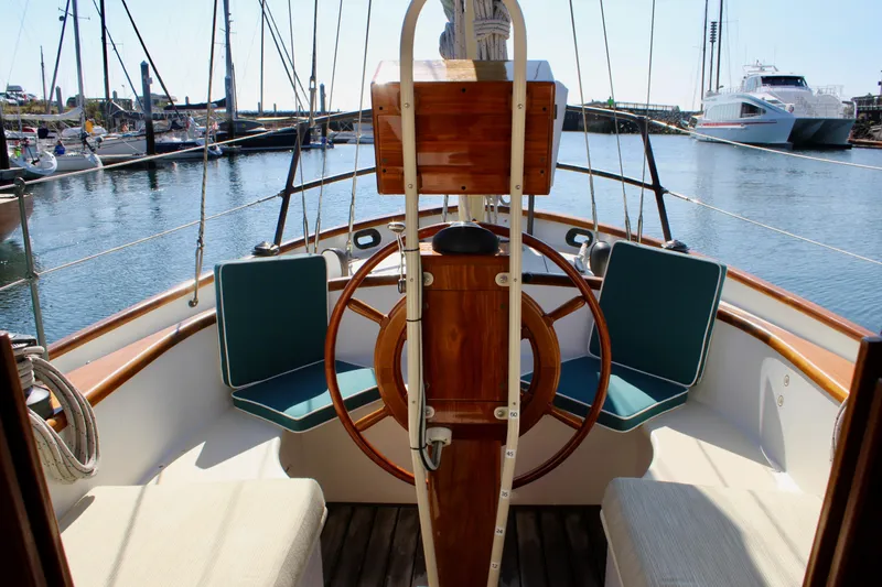 Slide: The Image of Cockpit of 2012 Custom Gartside Jespersen 40 sailboat with wooden wheel and seating. - 33