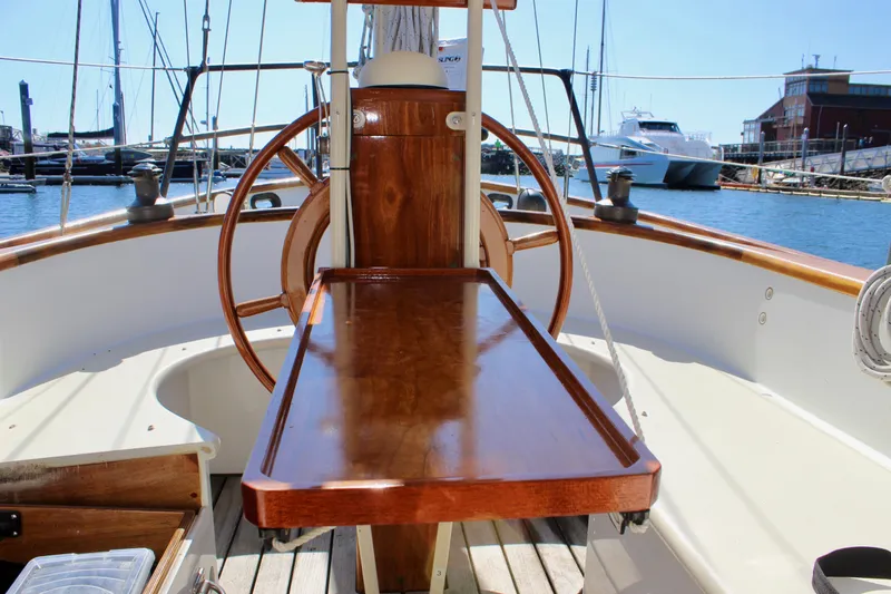 Slide: The Image of Cockpit of 2012 Custom Gartside Jespersen 40 sailboat with wooden table and steering wheel. - 36