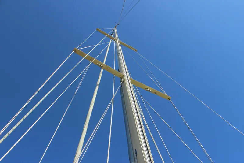 Slide: The Image of Sailboat mast and rigging against clear blue sky, Custom Gartside Jespersen 40, 2012. - 37