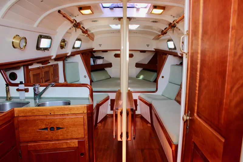 Slide: The Image of Interior of 2012 Custom Gartside Jespersen 40 sailboat with wood finish and seating. - 40