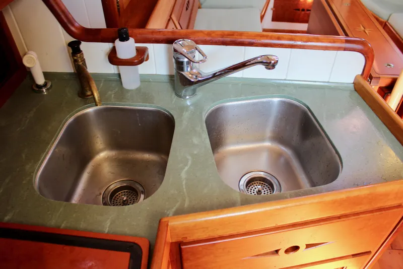 Slide: The Image of Dual stainless steel sinks in a 2012 Custom Gartside Jespersen 40 yacht kitchen. - 41