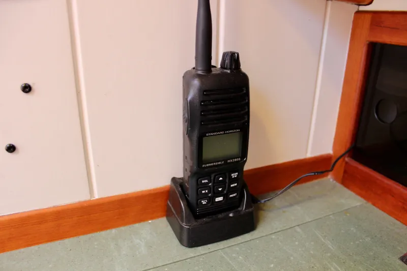 Slide: The Image of Handheld radio on charging dock inside 2012 Custom Gartside Jespersen 40 boat. - 47