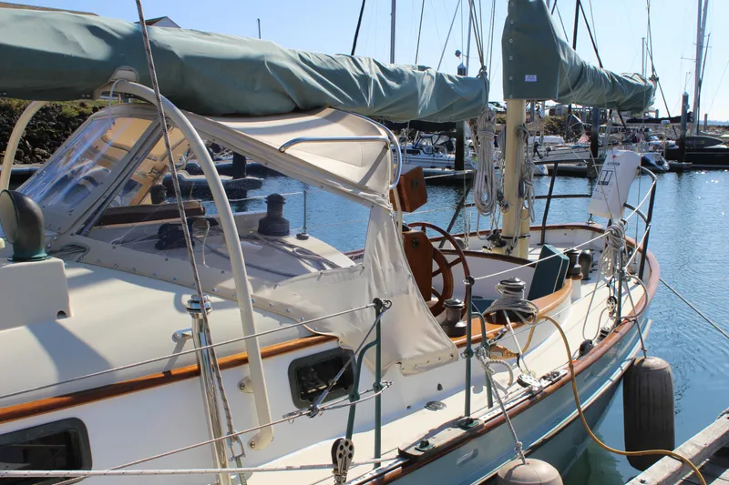 Slide: The Image of Sailboat docked in marina, Custom Gartside Jespersen 40, 2012 model, with covered mast and wooden accents. - 5