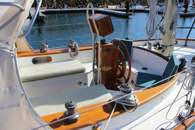 Slide: The Image of Cockpit of 2012 Custom Gartside Jespersen 40 sailboat with wooden helm and seating. - 6
