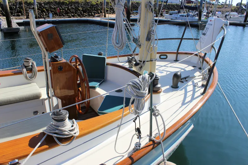 Slide: The Image of Sailboat "Gartside Jespersen 40" 2012 model, docked with wooden deck and steering wheel. - 7