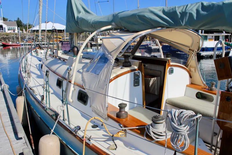 Slide: The Image of Sailboat docked at marina, Custom Gartside Jespersen 40, 2012 model, with blue sail cover. - 9