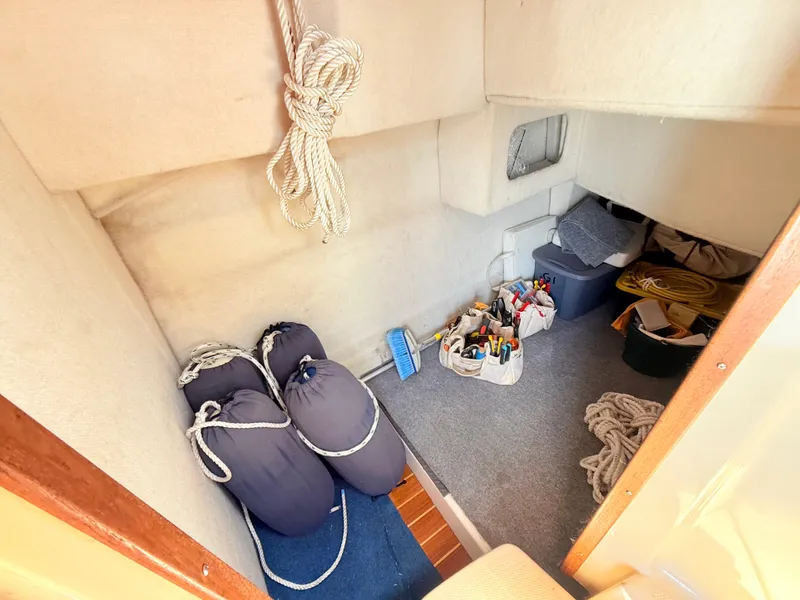 Slide: The Image of Interior storage area of 2009 Ranger Tugs R-29 boat with ropes and tools. - 18