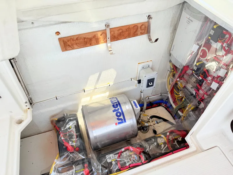 Slide: The Image of Engine compartment of a 2009 Ranger Tugs R-29, featuring electrical components and wiring. - 20