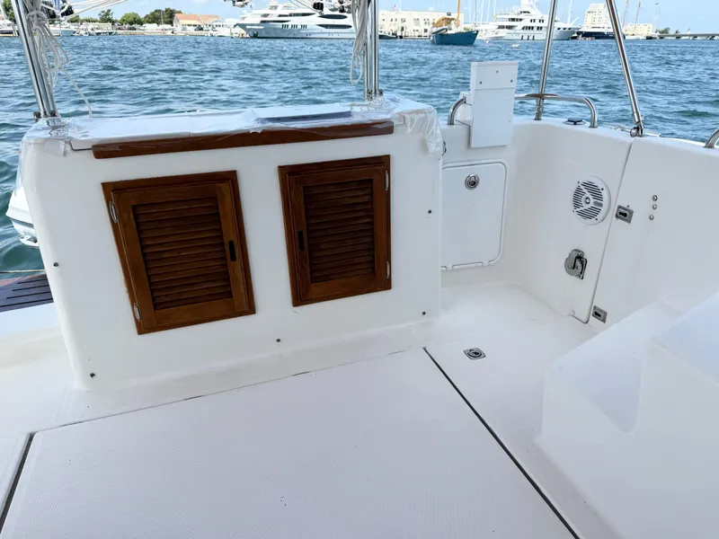 Slide: The Image of 2009 Ranger Tugs R-29 boat deck with wooden cabinets and ocean view. - 9
