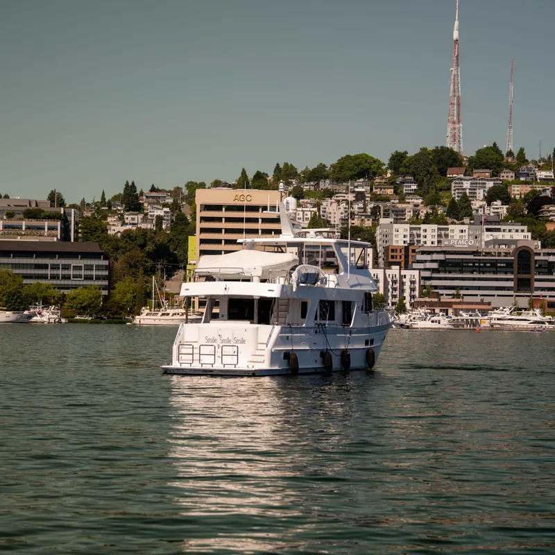 Slide: The Image of 2022 Outer Reef Yachts 720 Motoryacht cruising near urban waterfront. - 14