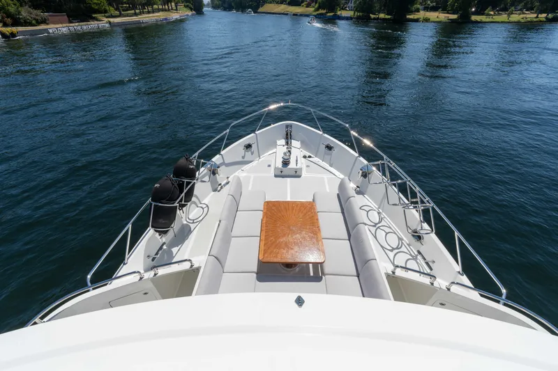 Slide: The Image of 2022 Outer Reef Yachts 720 Motoryacht cruising on a serene waterway. - 24