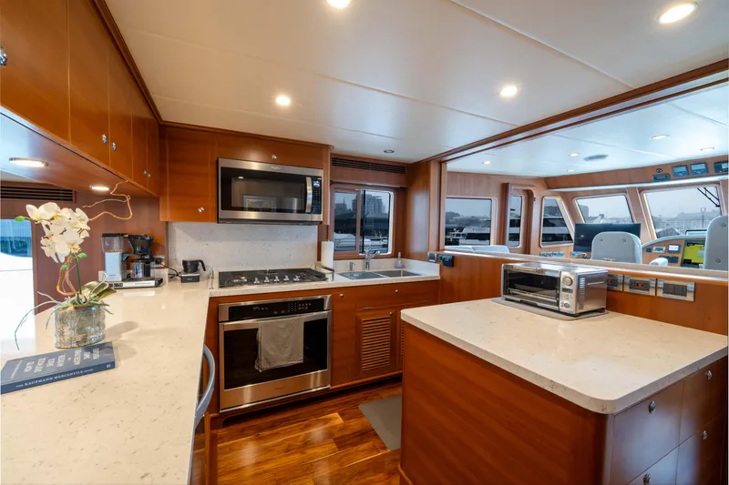 Slide: The Image of Luxurious kitchen interior of 2022 Outer Reef Yachts 720 Motoryacht with modern appliances. - 32