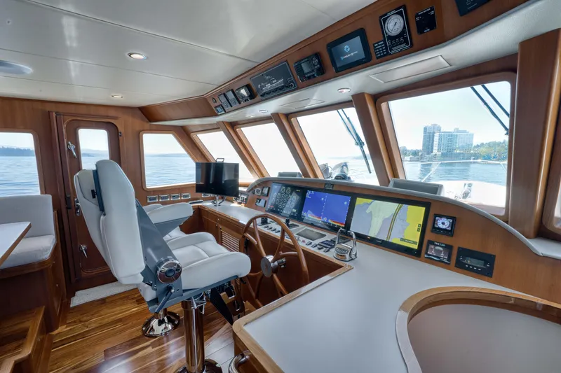 Slide: The Image of Luxurious 2022 Outer Reef Yachts 720 Motoryacht helm with advanced navigation systems. - 38