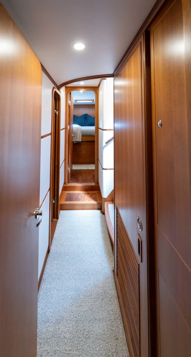 Slide: The Image of Luxurious hallway in 2022 Outer Reef Yachts 720 Motoryacht with wooden paneling. - 43