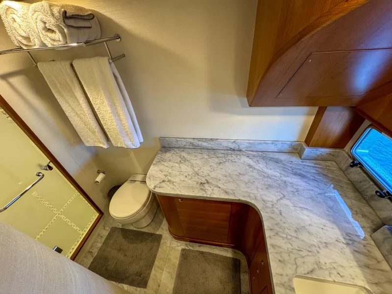 Slide: The Image of Luxurious bathroom in 2022 Outer Reef Yachts 720 Motoryacht with marble countertop and modern fixtures. - 49