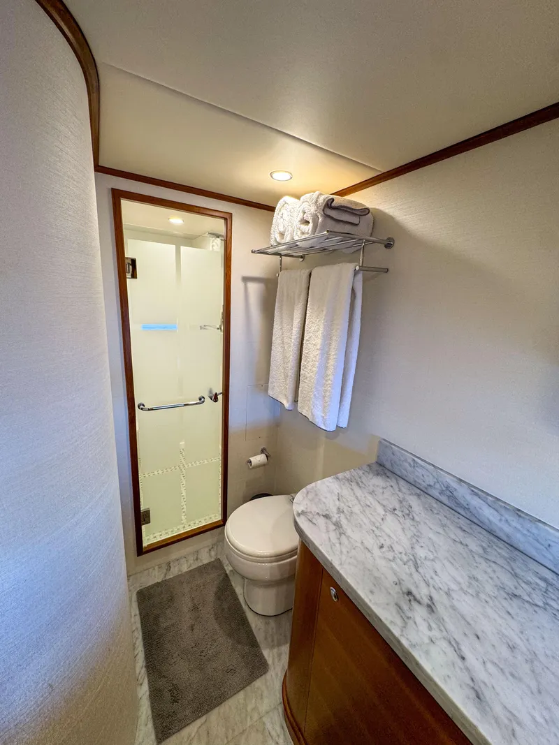 Slide: The Image of Luxurious bathroom in 2022 Outer Reef Yachts 720 Motoryacht with marble countertop and shower. - 50