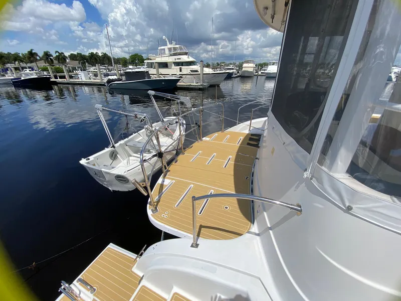 Slide: The Image of 2007 Manta 44 Power Cat docked at marina under cloudy sky. - 19