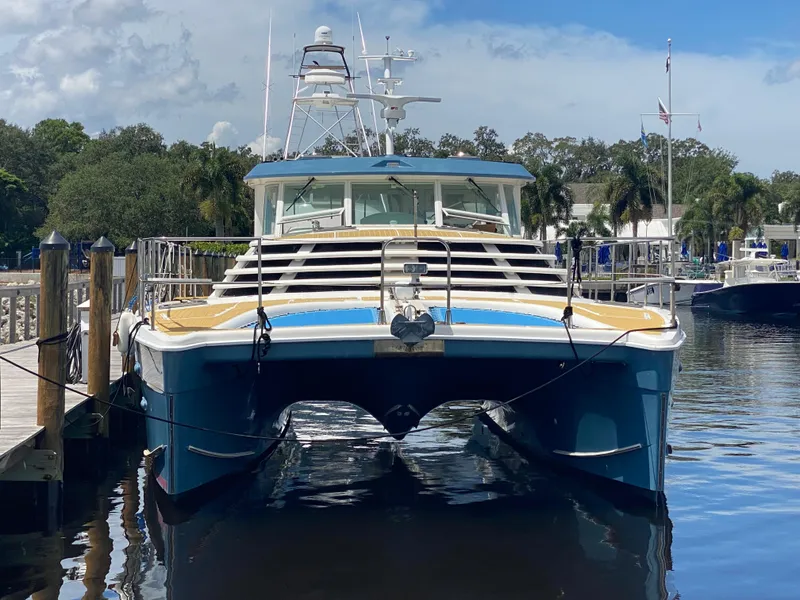 Slide: The Image of 2007 Manta 44 Power Catamaran docked at marina, front view. - 2