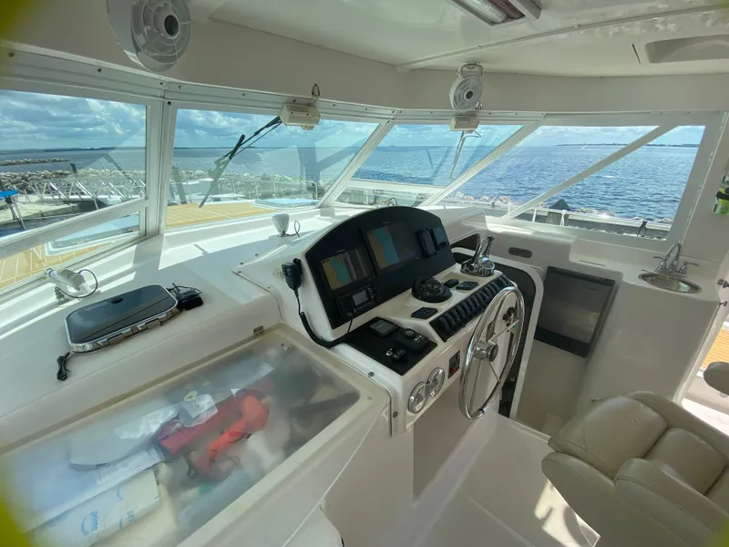 Slide: The Image of Interior helm of 2007 Manta 44 Power Cat with ocean view. - 27