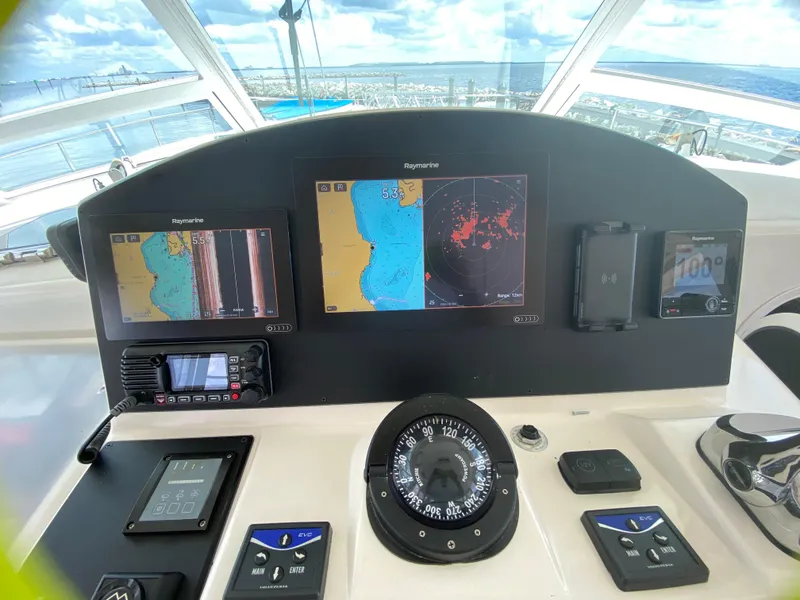 Slide: The Image of 2007 Manta 44 Power Cat helm with navigation screens and compass. - 29