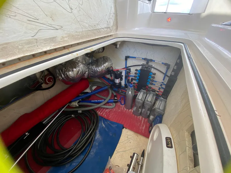 Slide: The Image of Engine room of 2007 Manta 44 Power Cat with hoses and equipment. - 31