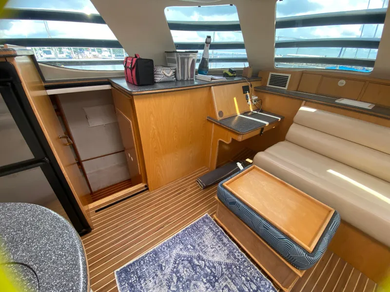 Slide: The Image of Interior of 2007 Manta 44 Power Cat with modern seating and wooden finishes. - 38