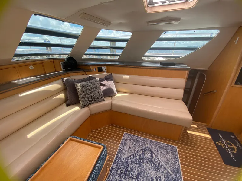 Slide: The Image of Interior of 2007 Manta 44 Power Cat with plush seating and nautical decor. - 39