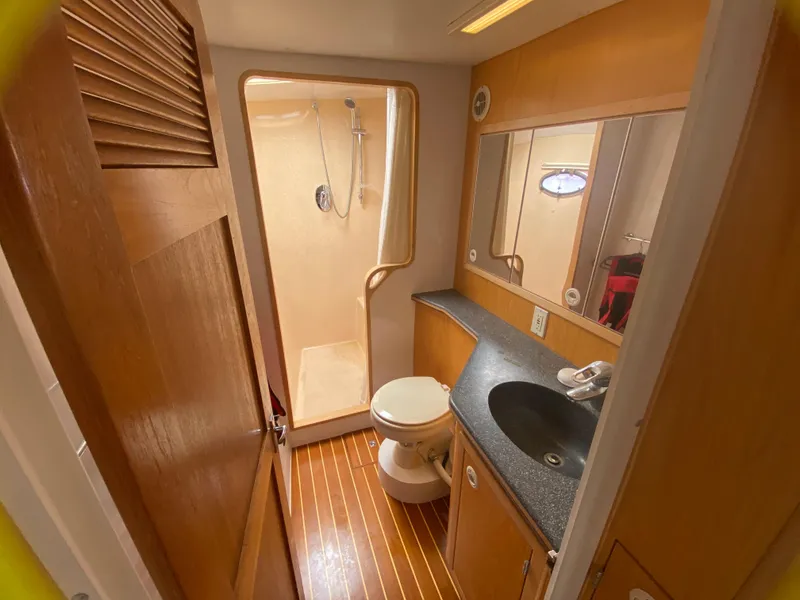 Slide: The Image of Bathroom interior of 2007 Manta 44 Power Cat with shower, sink, and toilet. - 41