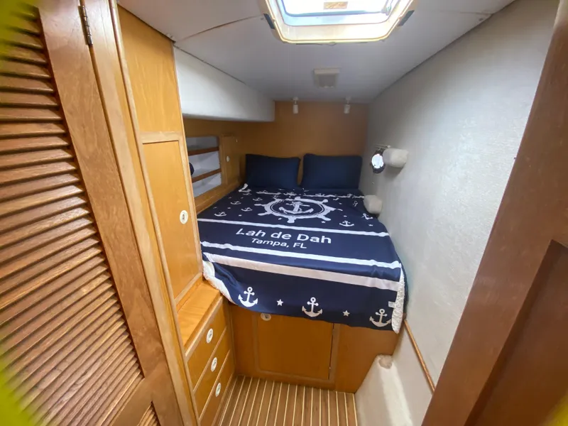 Slide: The Image of Cozy cabin interior of 2007 Manta 44 Power Cat with nautical-themed bedding. - 42