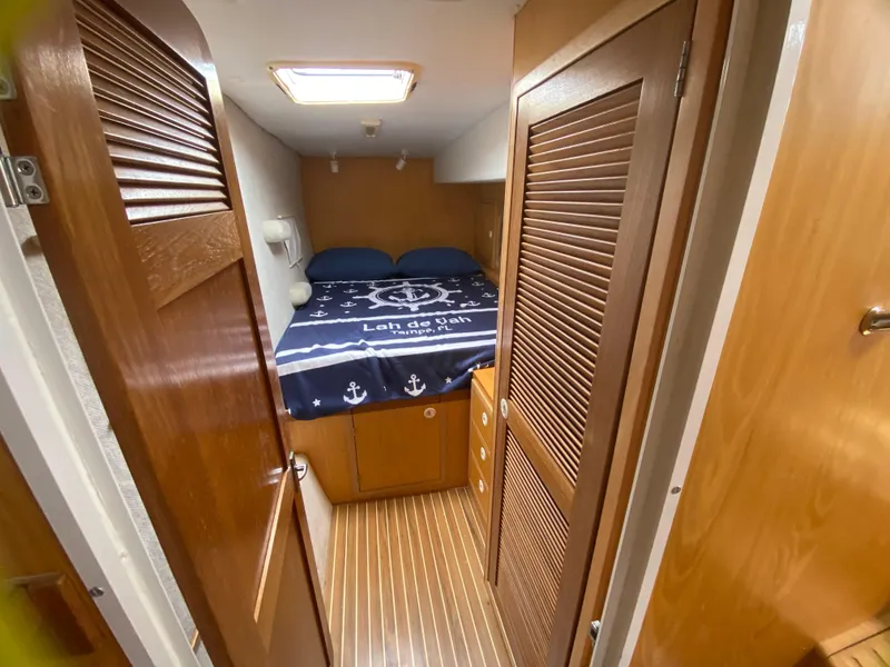 Slide: The Image of Cozy cabin interior of 2007 Manta 44 Power Cat with nautical bedding. - 47