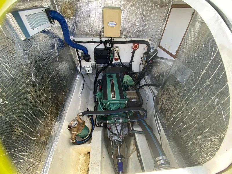 Slide: The Image of Engine compartment of 2007 Manta 44 Power Cat with visible machinery and wiring. - 49