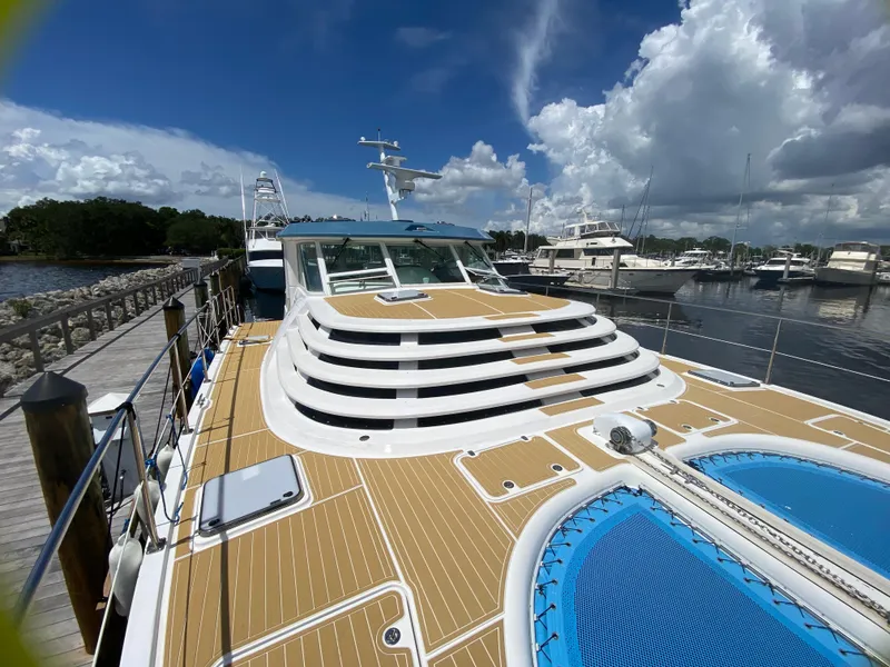 Slide: The Image of 2007 Manta 44 Power Cat docked, featuring spacious deck and modern design. - 6