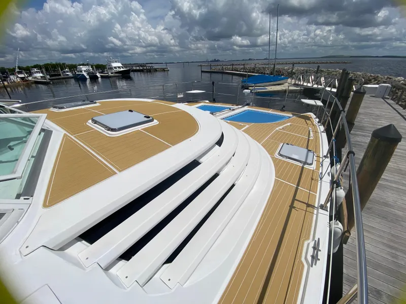 Slide: The Image of 2007 Manta 44 Power Cat docked at marina under cloudy sky. - 9