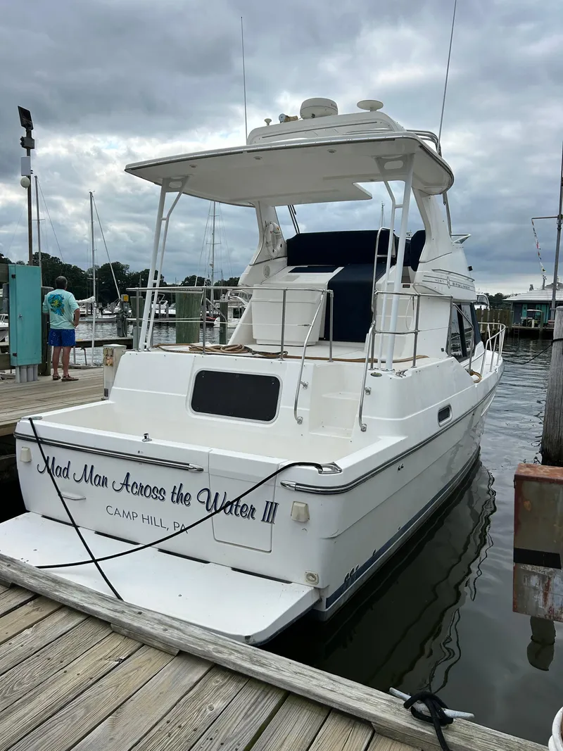 The Image of 2000 Bayliner 4087 Motoryacht docked at marina, rear view. - 1