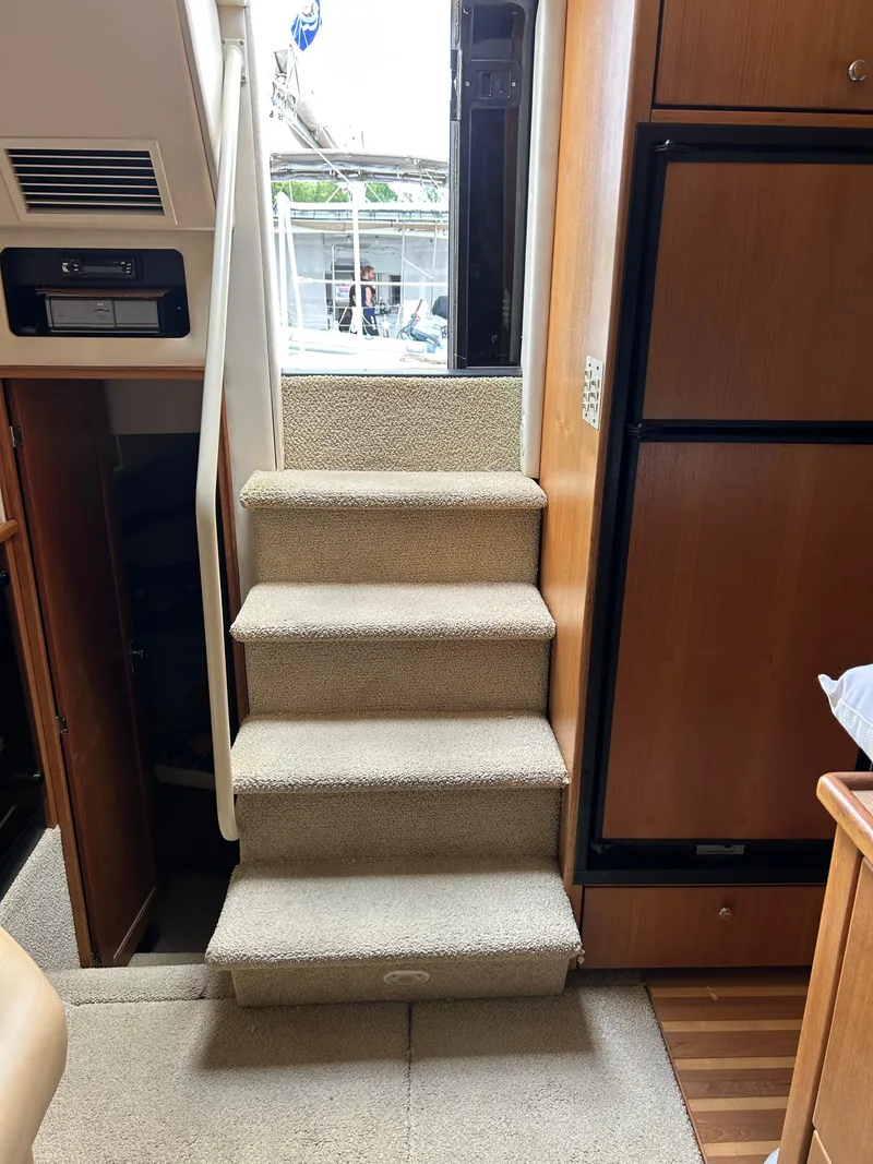Slide: The Image of Interior stairs of 2000 Bayliner 4087 Motoryacht, leading to upper deck. - 11