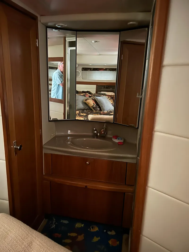 Slide: The Image of Bayliner 4087 Motoryacht 2000 bathroom vanity with mirror and sink. - 18