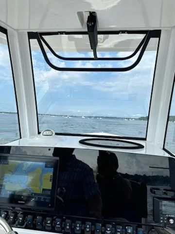 Slide: The Image of Interior view of 2022 Sea Hunt Ultra 265 SE boat with navigation system. - 8