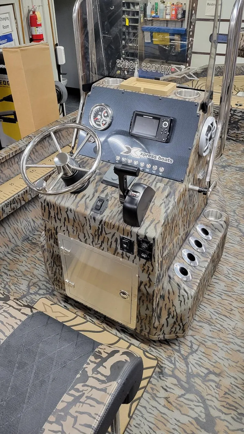 Slide: The Image of 2025 Xpress H22 Bay boat console with Yamaha Vmax 175 SHO, camo design. - 11