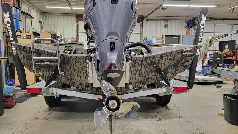 Slide: The Image of 2025 Xpress H22 Bay boat with Yamaha Vmax 175 SHO in a workshop. - 14