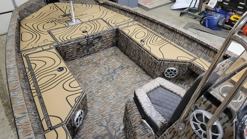 Slide: The Image of 2025 Xpress H22 Bay boat interior with camo design and Yamaha Vmax 175 SHO engine. - 16