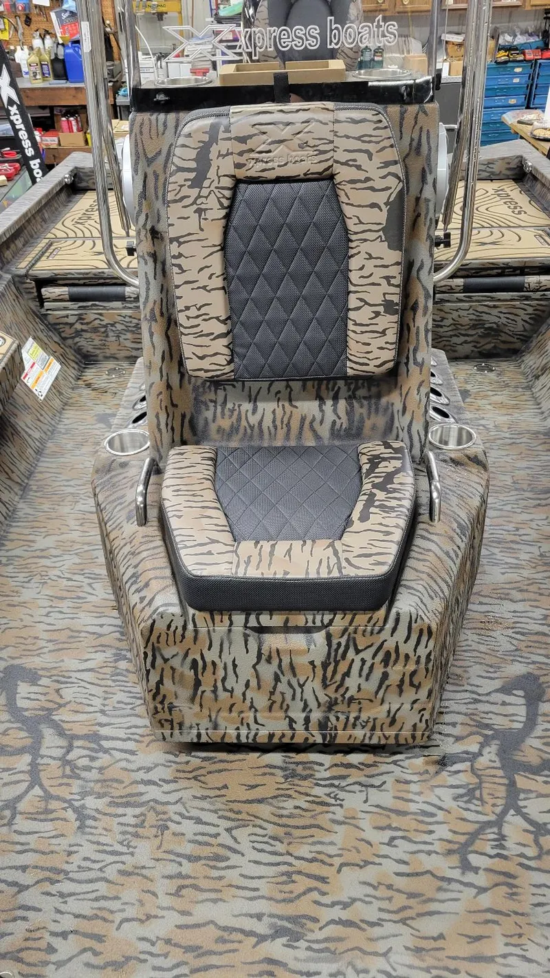 Slide: The Image of 2025 Xpress H22 Bay boat seat with camouflage design and diamond-patterned upholstery. - 20