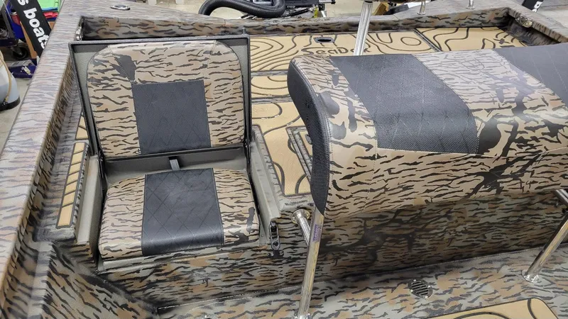 Slide: The Image of 2025 Xpress H22 Bay boat interior with camouflage seating and Yamaha Vmax 175 SHO engine. - 22