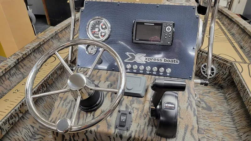 Slide: The Image of 2025 Xpress H22 Bay boat dashboard with Yamaha Vmax 175 SHO controls and gauges. - 23