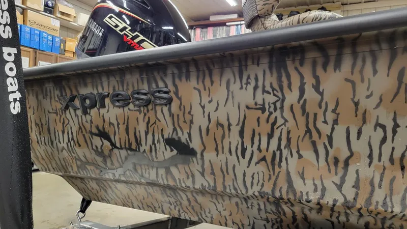 Slide: The Image of 2025 Xpress H22 Bay boat with Yamaha Vmax 175 SHO, camo design, in stock. - 3