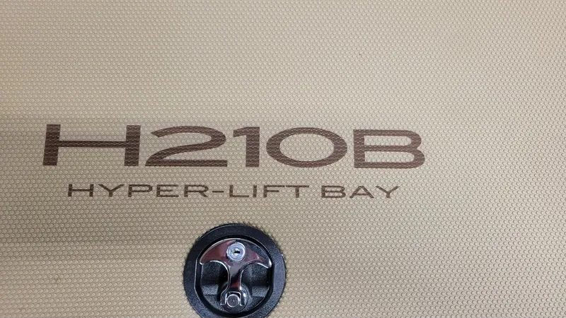 Slide: The Image of 2025 Xpress H210 Bay Hyper-Lift logo on textured surface. - 16