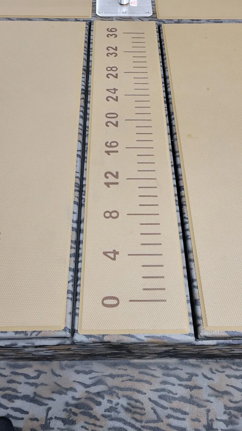 Slide: The Image of Ruler on deck of 2025 Xpress H210 Bay boat with Yamaha 150 engine. - 6