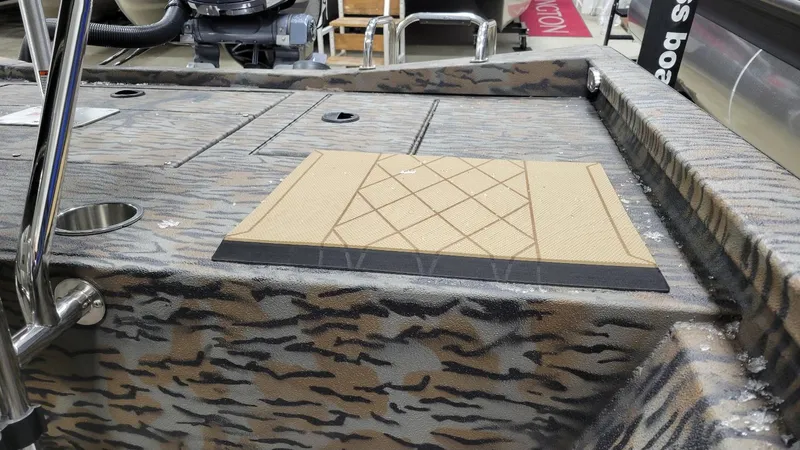 Slide: The Image of 2025 Xpress H210 Bay boat deck with camo pattern and Yamaha F150 engine. - 18